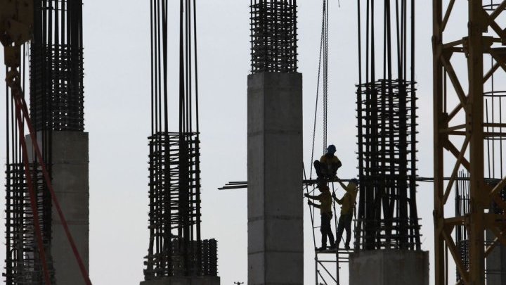 The low paid workers propping up Manila's construction boom